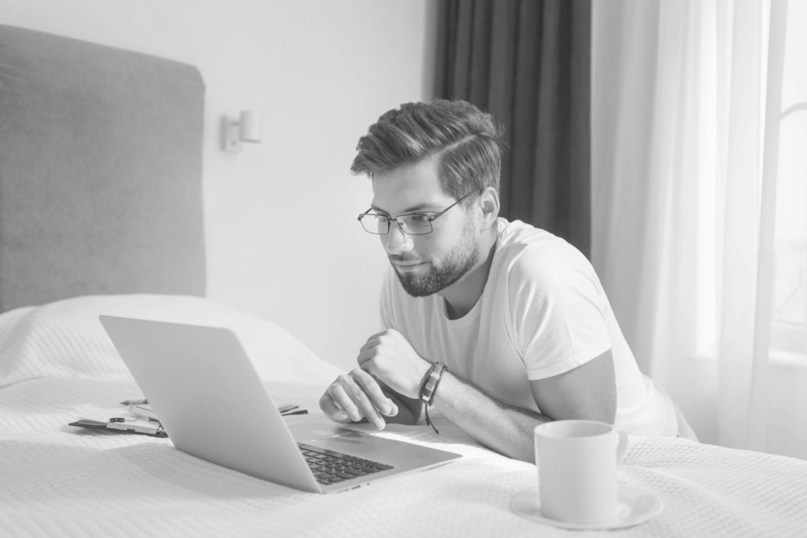 Professional monitoring investment portfolio from home workspace